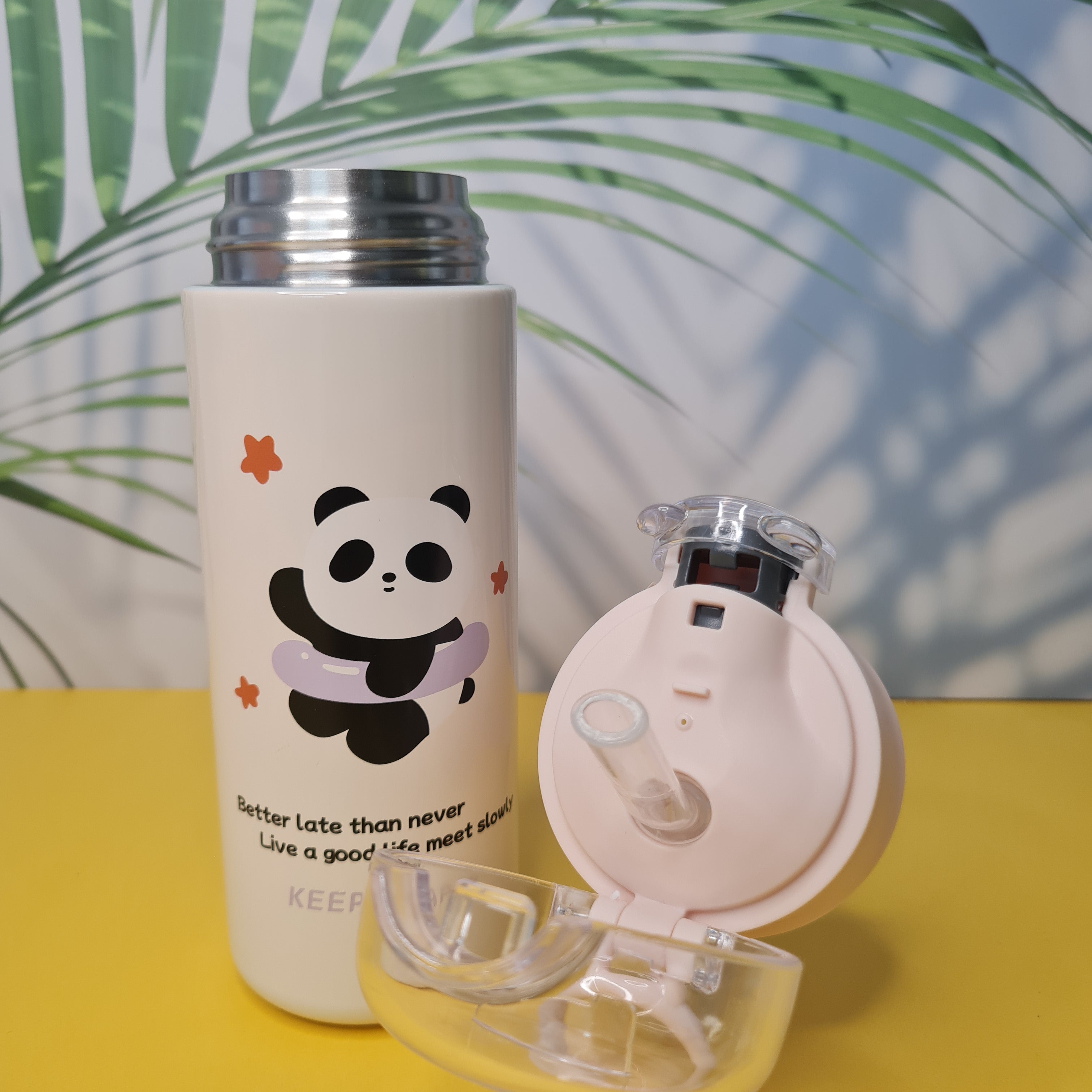 White water bottle with panda design on a yellow background